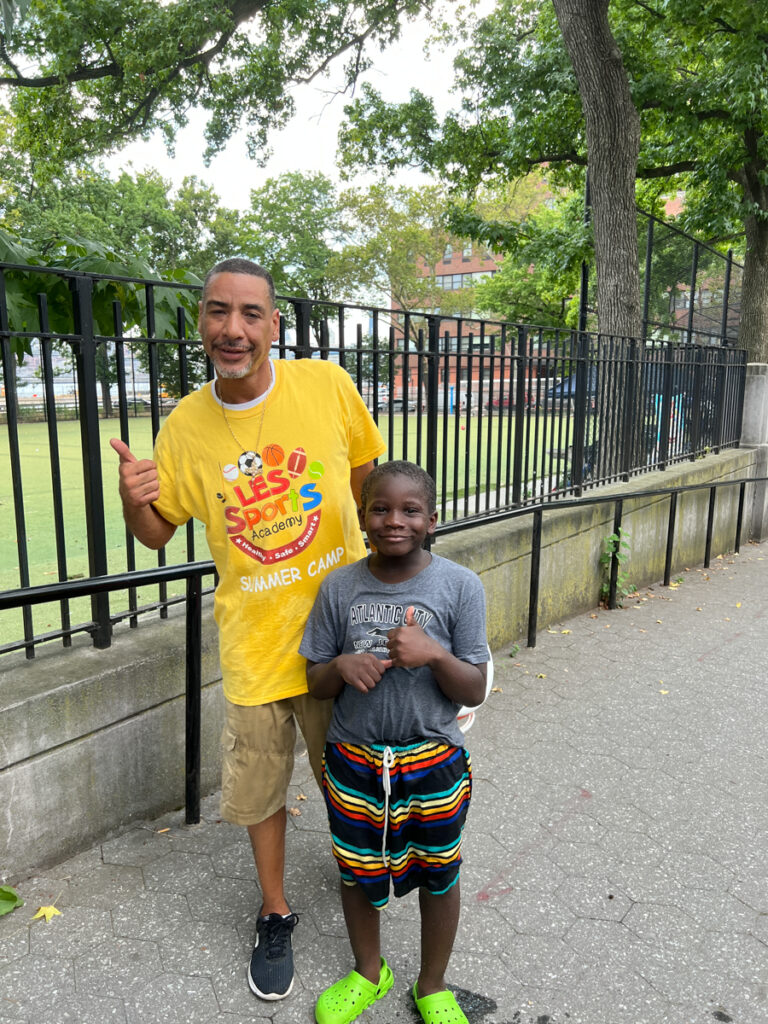 These two from the LES Sports Academy had cooled off in a spray fountain and were heading for some shade in Corlears Hook Park.
